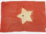 an old red and white flag with a star on it