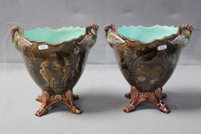 two vases that are sitting next to each other on a table