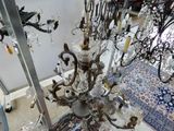 a chandelier that has a lot of glass hanging from it