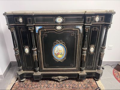 a black cabinet with a picture on the front
