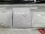 a pile of mattresses that are in a box