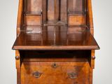 an old wooden desk with drawers and drawers on top of it