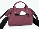 the small purse is pink and has a white tissue in it