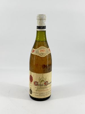 an image of a bottle of wine sitting on top of a white table