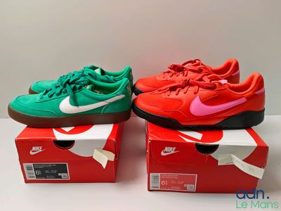 two pairs of red and green sneakers are sitting on a box