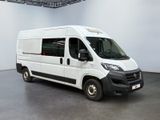 a white van that is parked in a large room