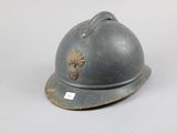 a helmet that is sitting on a white surface