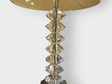 a close up of a table lamp with a shade on top of it
