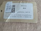 a label on the back of a chair that says welcome