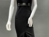 an image of a mannequin dressed in a black dress