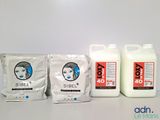 three bottles of milk sitting next to each other on a table