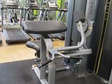 a gym room with treads, machines, and other equipment in it