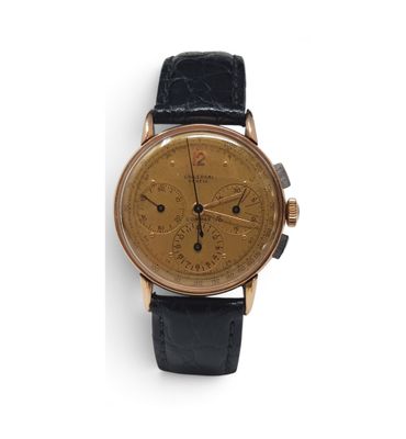 a close up of a watch on a white surface