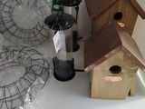 many birdhouses on a shelf in the kitchen