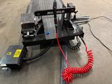 an image of a machine with a coiled cord attached to it