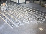 a large metal structure that is being constructed in a warehouse