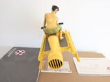 a figurine of a man on a motorcycle on a box