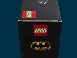 lego batman figure in a box on a blue background