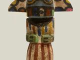 an image of a sculpture of a horned head on a wooden base