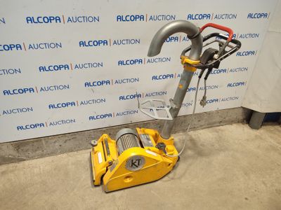 an image of a yellow vacuum cleaner sitting on the floor in front of a wall