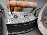 an old iron that is sitting on a table