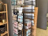 a display of cards on a metal rack in a store