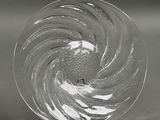 a glass plate with a spiral design on it
