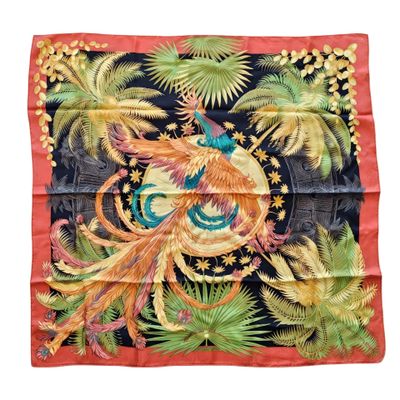 a black and red silk scarf with a colorful bird on it