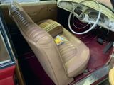 a tan leather seat in the back of a car