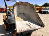 a dump truck that is sitting in the dirt