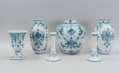four vases that are sitting next to each other on a table