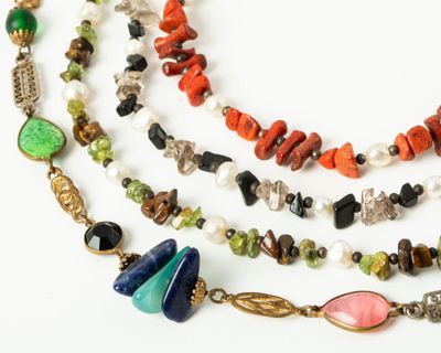 an image of a multi - stranded necklace with multi colored beads