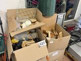 a pile of boxes sitting outside of a store