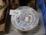 a lot of plates that are sitting on a shelf