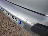 a close up of a car ' s bumper with a number plate on it