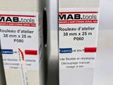 two boxes of mab tools are stacked on top of each other