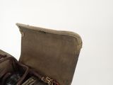 a brown bag with a pair of shoes inside of it