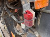 a close up of a truck ' s rear end with a red light