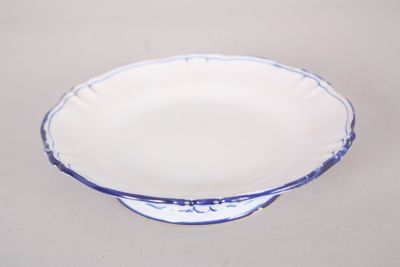 a blue and white bowl sitting on a table