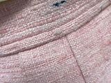 a close up of a person ' s pink pants with a white shirt