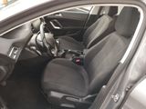 the interior of a car with black seats and a black steering wheel