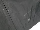 a close up of the back of a black jacket on a white background