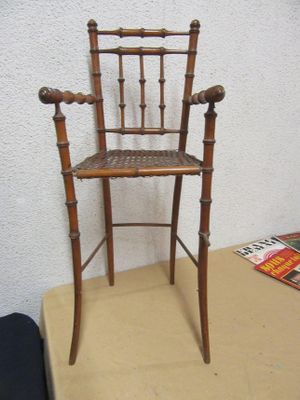 a wooden chair that is sitting on a table