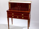 a small desk with a drawer on top of it
