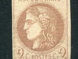 a close up of a stamp with a woman on it