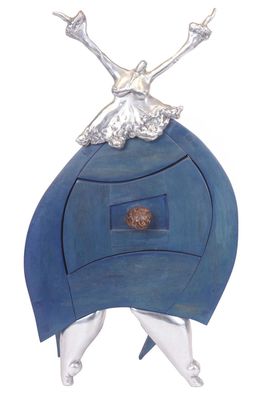a sculpture of a woman sitting on top of a blue object