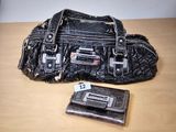 a purse and wallet sitting on a table next to each other