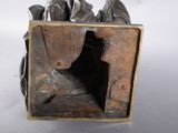 a bronze sculpture of a horse in a box
