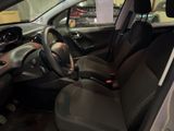 the interior of a small car with a steering wheel and dashboard
