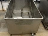 an image of a stainless steel sink sitting in a room